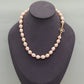 A beautiful 100% handmade, freshwater pearl necklace with golden flower buckle, 10mm, perfect for bridal jewelry, Mother's Day, birthday gifts, parties, giving the perfect ideal gift choice[NK-XL2501-Pink-01]